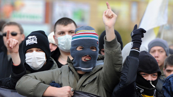 Participants in the Russian March rally held to mark up the National Unity Day in Moscow\s Lyublino district. (RIA Novosti/Iliya Pitalev)