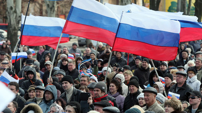 Pro-Russian supporters hold Russian flags during a rally in the center of the eastern Ukrainian city of Donetsk on April 5, 2014.  (AFP Photo)