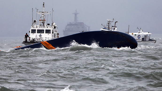 Vessels involved in salvage operations are seen near the upturned South Korean Sewol ferry in the sea off Jindo April 17, 2014 (Reuters / Issei Kato)