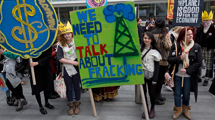 Demonstrators hold banners during an anti-fracking protest in central London (Reuters / Neil Hall)