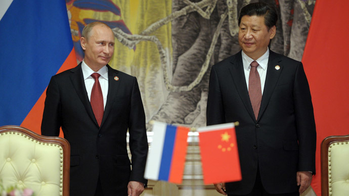 May 21, 2014. President Vladimir Putin, left, and Chinese leader Xi Jinping during the signing of joint agreements in Shanghai. (RIA Novosti/Alexei Druzhinin)