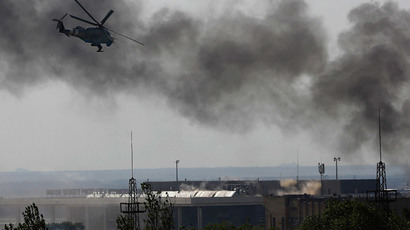A Ukrainian helicopter Mi-24 gunship fires its cannons against anti-government forces at the main terminal building of Donetsk international airport May 26, 2014. (Reuters / Yannis Behrakis)