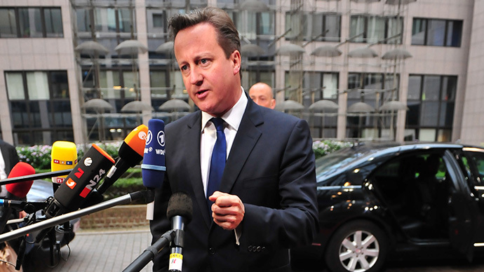 Britain Prime minister David Cameron answers journalists' questions on May 27, 2014 as he arrives to take part in the Informal European Council at the EU Headquarters in Brussels. (AFP Photo / Georges Gobet)