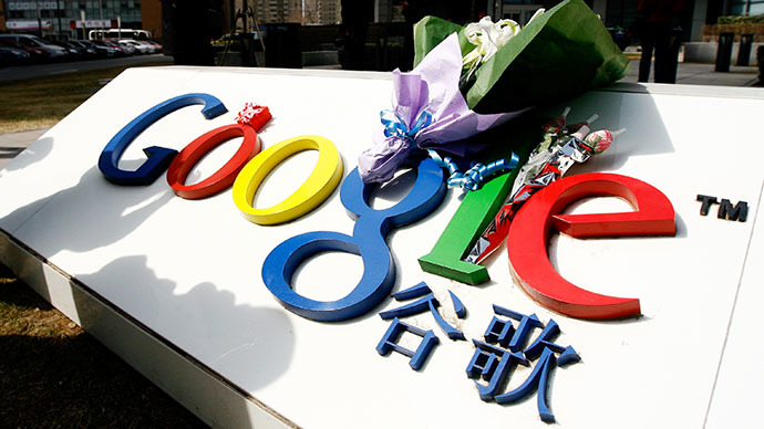 A bouquet of flowers lies on the Google logo outside the company's China head office in Beijing on March 23, 2010 after the US web giant said it would no longer filter results and was redirecting mainland Chinese users to an uncensored site in Hong Kong — effectively closing down the mainland site. (AFP Photo / Li Xin)