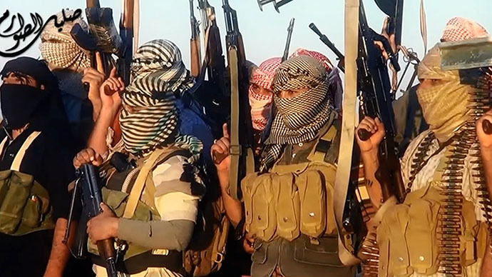 ISIS fighters celebrating in Tikrit last month (AFP Photo)