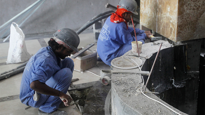 Labourers work at a construction site in Doha, Qatar (Reuters / Stringer)
