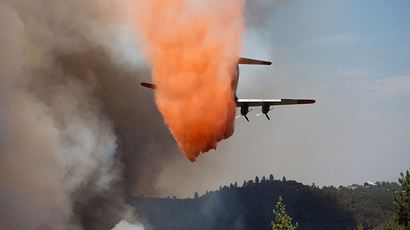 An air tanker drops retardant on the fast-moving wildfire called "Sand Fire" near Plymouth, California July 26, 2014. (Reuters / Max Whittaker)