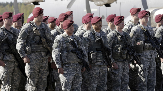 First company-sized contingent of about 150 U.S. paratroopers from the U.S. Army's 173rd Infantry Brigade Combat Team based in Italy attend a welcome ceremony in the airport in Riga April 24, 2014. (Reuters/Ints Kalnins)