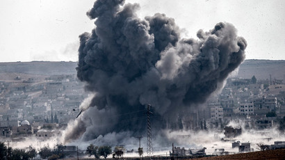 A picture taken from the Turkish border near the southeastern village of Mursitpinar, in the province of Sanliurfa shows smoke billowing after a jet fighter hit Kobane, also known as Ain al-Arab, on October 28, 2014. (AFP Photo / Stringer)