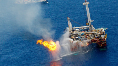 A drilling platform near the Transocean Discoverer Enterprise drillship burns off gas collected at the BP Deepwater Horizon oil spill on June 25, 2010 in the Gulf of Mexico off the coast of Louisiana. (Chris Graythen / Getty Images / AFP)