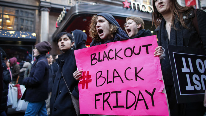 Protesters march outside Macy's store during the Black Friday protest on November 28, 2014 in New York. (AFP Photo/Kena Betancur)
