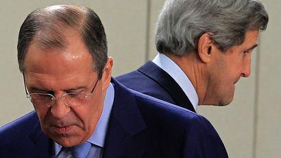 U.S. Secretary of State John Kerry (R) walks behind Russian Foreign Minister Sergey Lavrov (Reuters / Yves Herman)