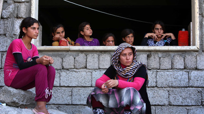 Iraqi Yazidi women who fled the violence in the northern Iraqi town of Sinjar. (AFP Photo/Safin Hamed)