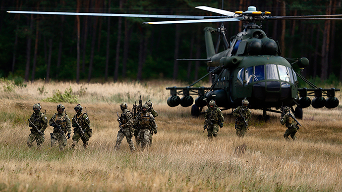 Members of Poland's special commando unit Lubliniec disembark from a Mi-17 helicopter during the "Noble Sword-14" NATO international tactical exercise at the land forces training centre in Oleszno, near Drawsko Pomorskie, northwest Poland (Reuters / Kacper Pempel)