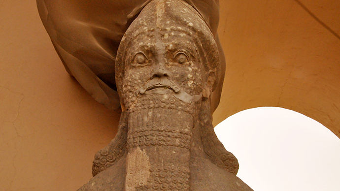 Partial view of an ancient statue dated from the Assyrian civilization, at the archaeological site of Nimrud that lies on the Tigris River southeast of Mosul, Iraq ( AFP Photo / Hubert Debbasch)