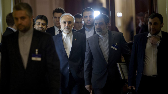 Head of Iranian Atomic Energy Organization Ali Akbar Salehi walks with others during a break in a meeting with world representatives seeking to pin down a nuclear deal with Iran at the Beau Rivage Palace Hotel in Lausanne March 31, 2015. (Reuters/Brendan Smialowski)