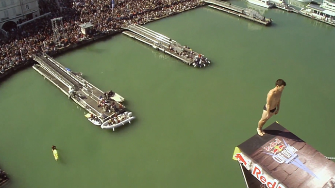 'Like a cat': Diver hits head during competition, lands feet-first in water (VIDEO)