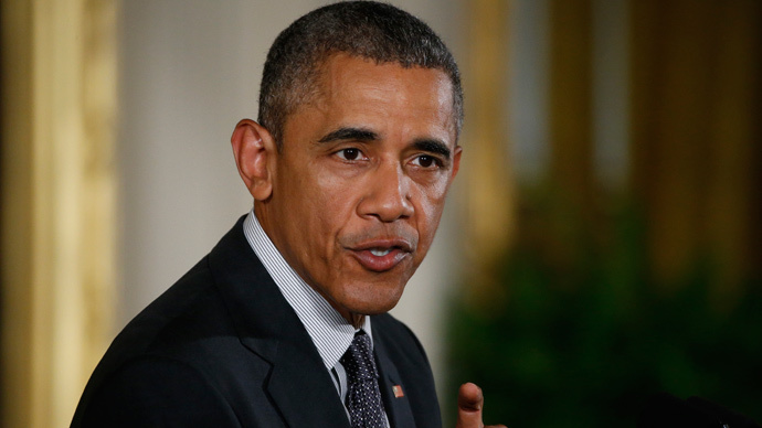 Obama signs bill giving himself fast-track powers for trade deals