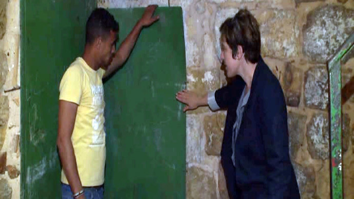 House divided: Israelis, Palestinians live under same Hebron roof, separated by brick wall