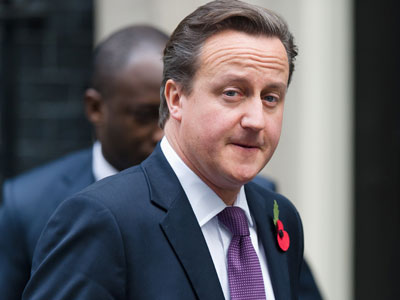 Britain calls for a cut in EU budget, warns on veto