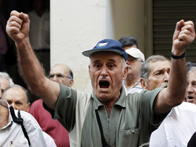 Greece agrees to raise retirement age, discusses further cuts