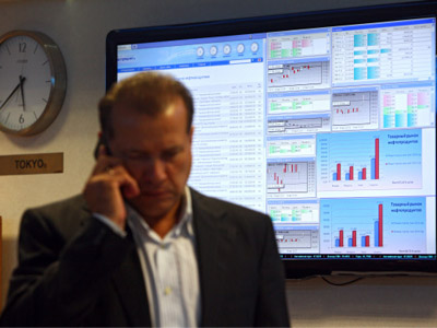 Russian stocks roller-coaster while currency slides