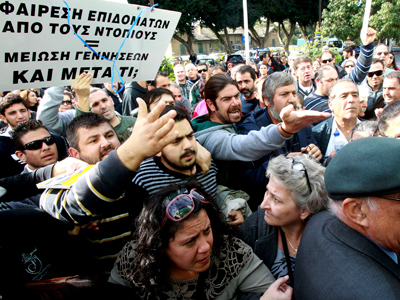 Cyprus hit by another downgrade from S&P, deal with Troika is questioned