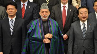 Japanese Foreign Minister Koichiro Gemba, Afghan President Hamid Karzai and Japanese Prime Minister Yoshihiko Noda pose during a group photo session prior to the opening of the Tokyo Conference on Afghanistan in Tokyo on July 8, 2012. (AFP Photo / Kazuhiro Nogi)