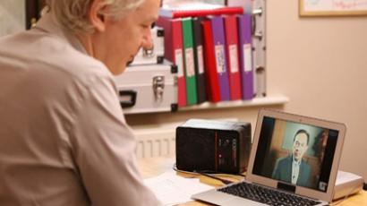 Julian Assange talking with Anwar Ibrahim