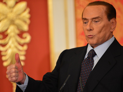Berlusconi feels 'obliged' to stay in politics despite fraud conviction