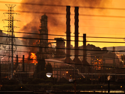 Firefighters douse a flame at the Chevron oil refinery in in Richmond, California August 6, 2012 (Reuters / Josh Edelson)