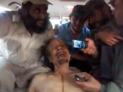 'Send this to Assad': New shock video shows rebels mocking Gaddafi body
