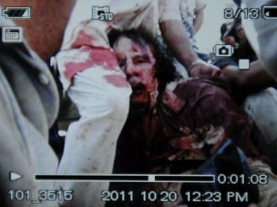 Captured Gaddafi covered in blood - FIRST PHOTO