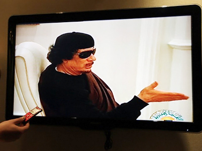 Gaddafi appears on TV after two-week absence