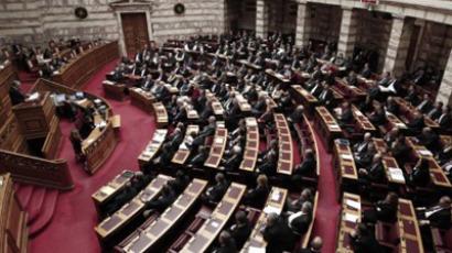 Greek Prime minister Lucas Papademos addresses lawmakers during a crucial vote in the parliament, in Athens, late on February 12, 2012 (AFP Photo / STR)