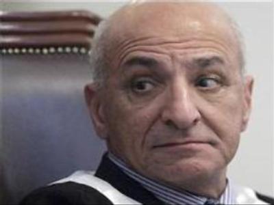 Hussein’s judge seeks refuge in UK