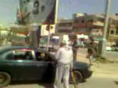 Militia and Gaddafi loyalists clash outside Tripoli