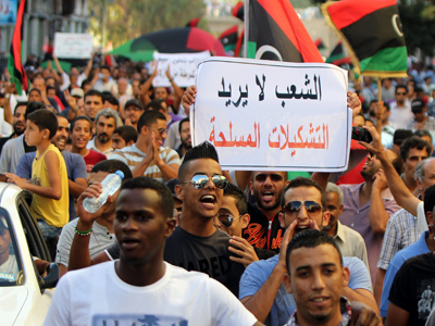 Libya to dissolve militias as Islamist strongholds fall