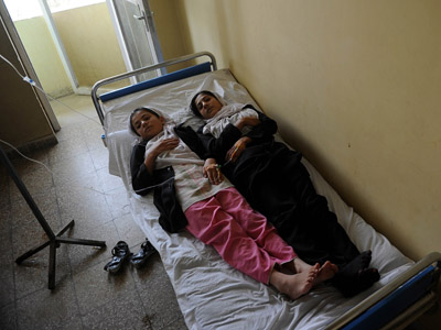Another mass poisoning in Afghanistan, as women flee fearing Taliban