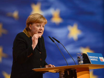 Merkel projected to win third term despite EU outrage