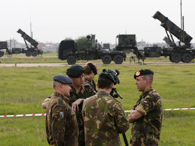 Dutch soldiers, with the Patriot system in the background, chat during media day at a military airbase in Adana, southern Turkey, January 26, 2013. (Reuters / Murad Sezer)