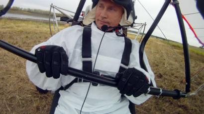 Russian President Vladimir Putin takes part in a scientific experiment as part of the "Flight of Hope", which aims to preserve a rare species of - cranes. At the helm of a trike that the birds have taken as their leader, Putin made three flights - the first to get familiar, and two others with the birds. 5 September 2012. (RIA Novosti)