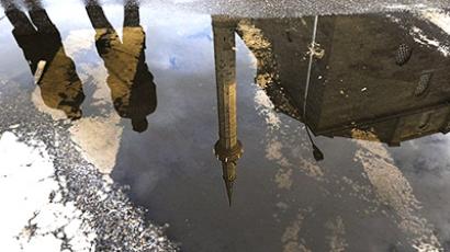 Serbia, Pristina: Kosovo Police are reflected in a puddle near the grand mosque in Pristina on September 9, 2010. (AFP Photo / Armend Nimani) 