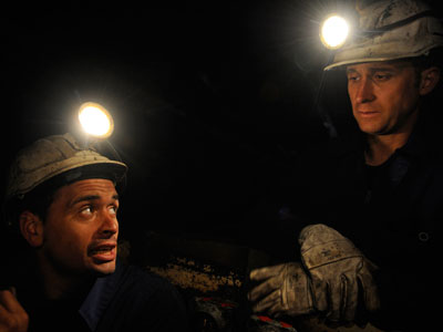 Up to 100 desperate miners barricade underground with explosives