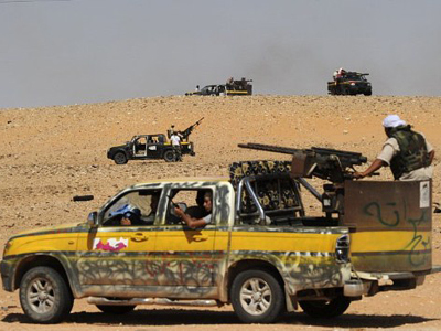 Rebels assault Gaddafi’s hometown