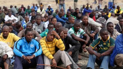 Mine workers gather while on strike near the scene of a shooting at Marikana, in the north western province August 27, 2012 (Reuters / Mike Hutchings)