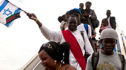 South Sudanese disembark from a plane from Israel that arrived at the airport in Juba June 18, 2012. Israel deported a planeload of migrants to South Sudan early on Monday, the first of a series of weekly repatriation flights intended as a stepping stone to dealing with much greater influxes of migrants from Sudan and Eritrea. (Reuters/Adriane Ohanesian)