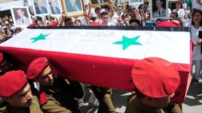 A photo released by the Syrian Arab news Agency (SANA) on April 27, 2011, shows one of 6 coffins of a killed member of either the army or security forces being taken from the October Military hospital in Damascus to their towns and villages for burial, following several days of unrest (AFP Photo)
