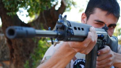 A member of the Free Syrian Army (The Brigade of the Revolution's Shield) attends a daily training in Sarmada, north of Idlib province (Reuters / Handout)