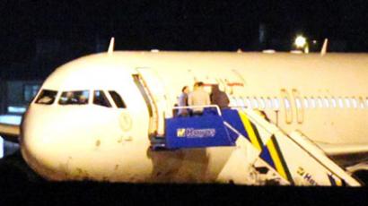 A Syrian passenger plane is seen after it was forced to land at Ankara airport on October 10, 2012.  (AFP Photo/Adem Altan)